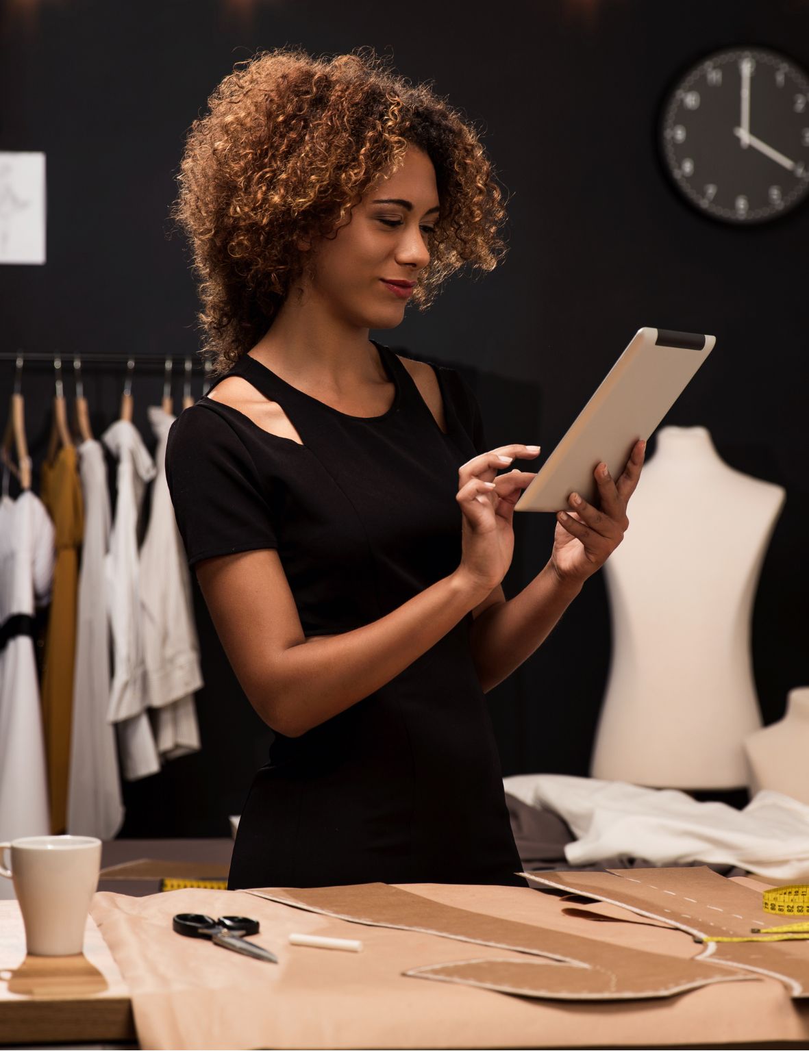 Woman working on patterns in a fashion studio